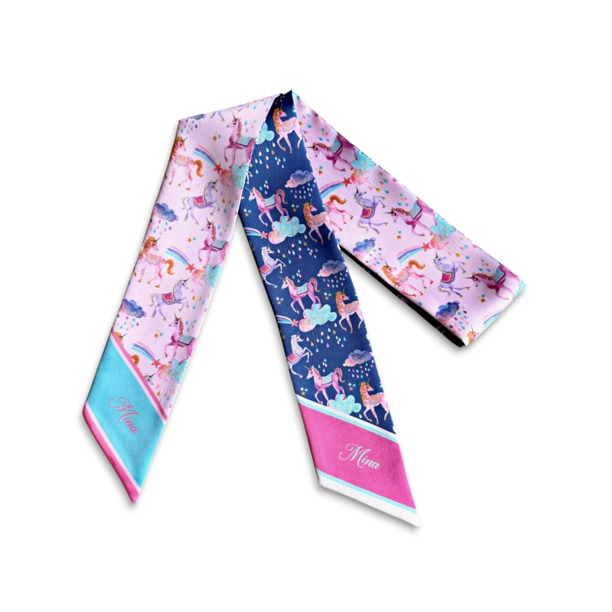 Skinny handbag scarves decorated with playful pink and purple unicorns, pastel rainbows, dreamy clouds, and personalised names on vibrant scarf tips.