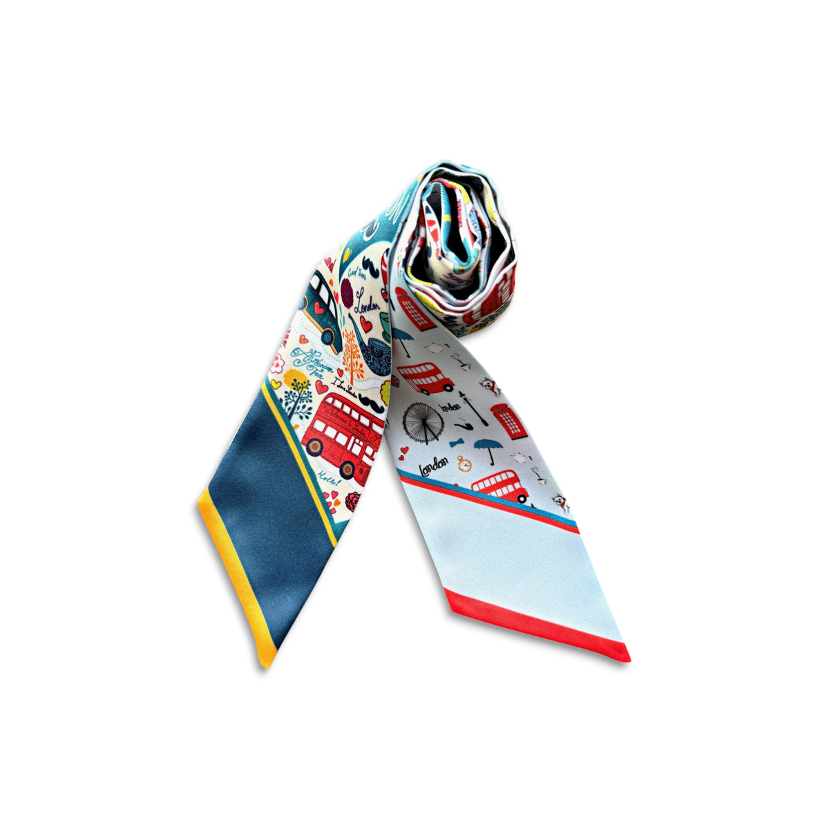 A rolled and laid-flat silk necktie featuring a London-themed print with red double-decker buses, black taxis, bicycles, and street elements on a white base, with a solid navy blue section and yellow stripe on the blade.