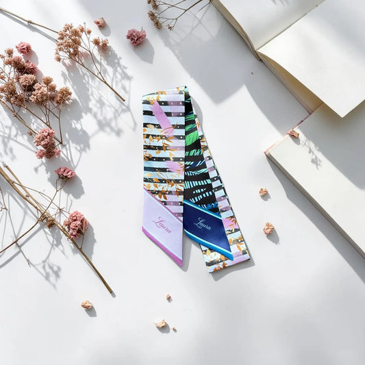 Double-sided twilly scarf with abstract leaf and stripe pattern in blue, black and pastel tones