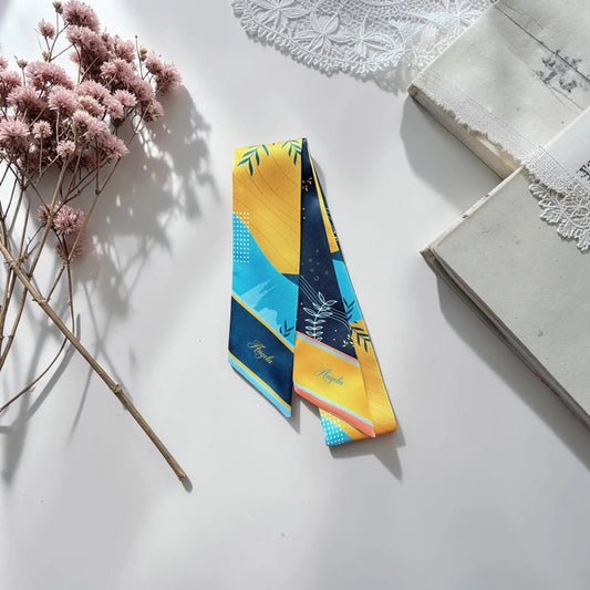 Modern skinny twilly scarf with abstract leaves and geometric shapes in blue and yellow double-sided design