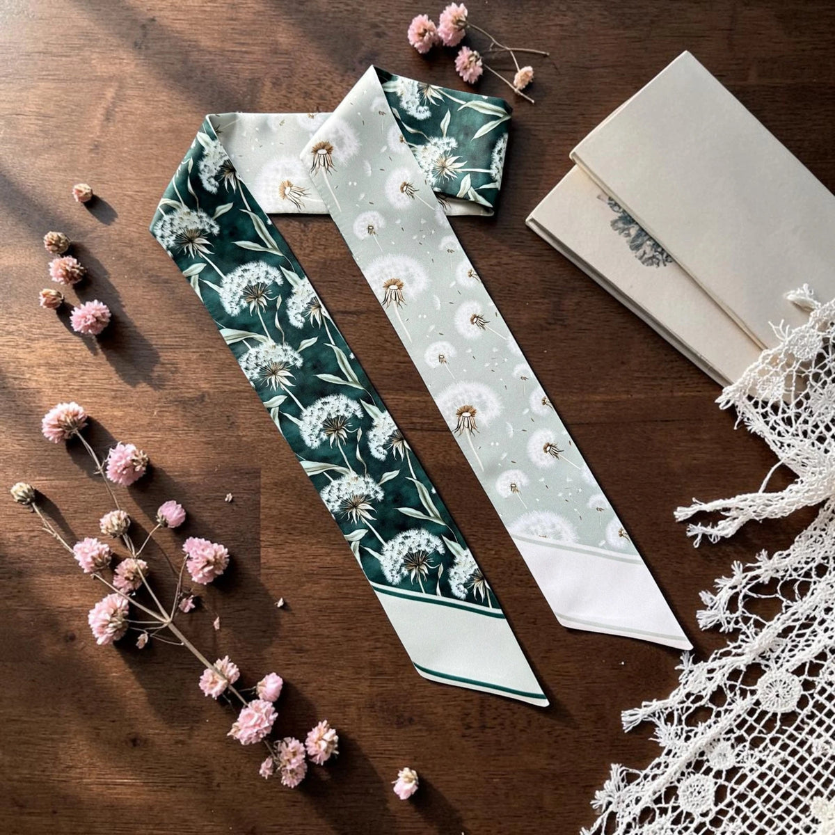 Sage green skinny scarf with delicate white dandelion botanical pattern