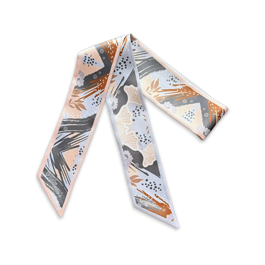 Elegant floral handbag scarf with artistic charcoal grey brushstrokes, delicate beige ginkgo leaves, terracotta accents, and subtle botanical illustrations.
