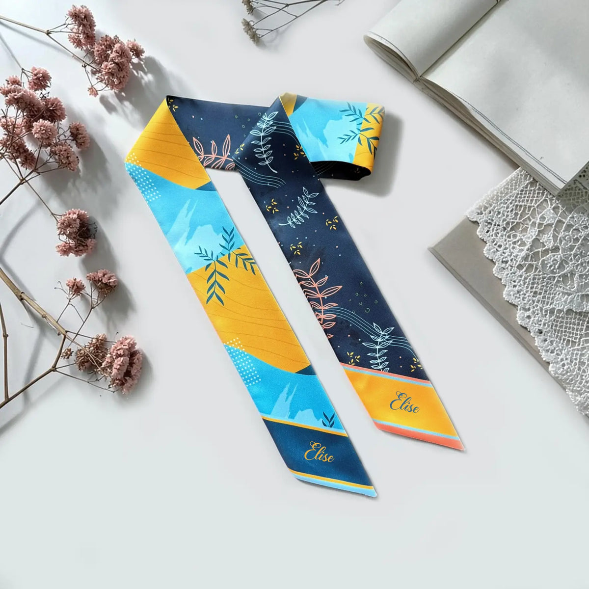 Personalised skinny scarf with navy, turquoise and mustard botanical leaf pattern and custom name.