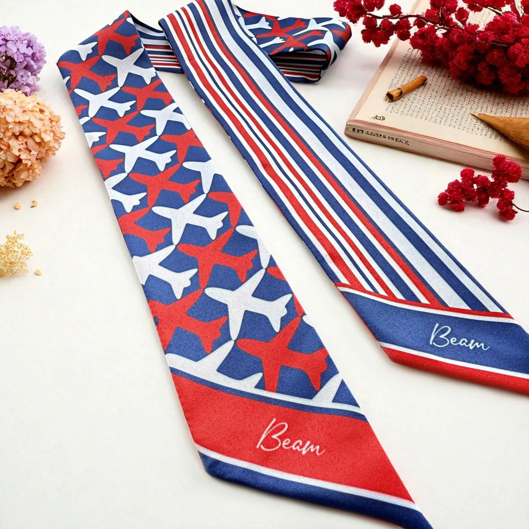 Travel-inspired twilly scarf featuring aircraft motif with classic stripe design in red and blue colours