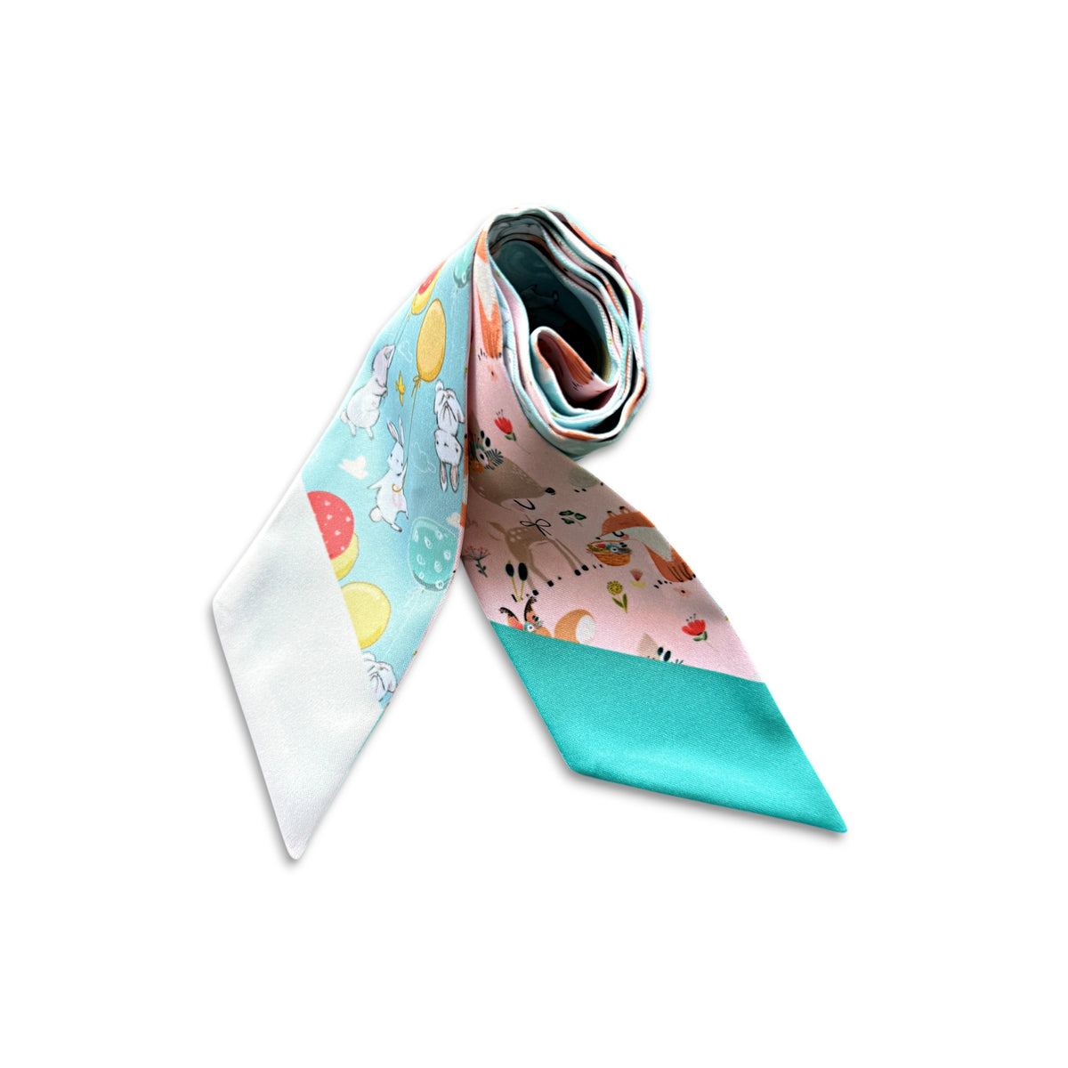 A rolled-up silk necktie featuring a whimsical multicolor pattern with cartoon animals, pastel fruit, and a solid turquoise lower section, displayed on a clean white background.