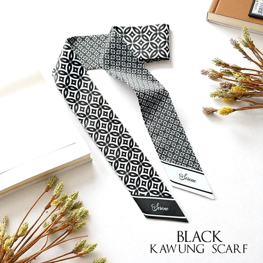 Black and white monochrome Kawung batik satin twilly scarf with intricate geometric motifs and personalised name details on contrasting pointed ends.