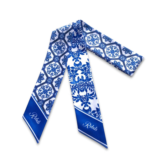 Full view of blue and white twilly scarf with intricate Chinoiserie tile and botanical patterns