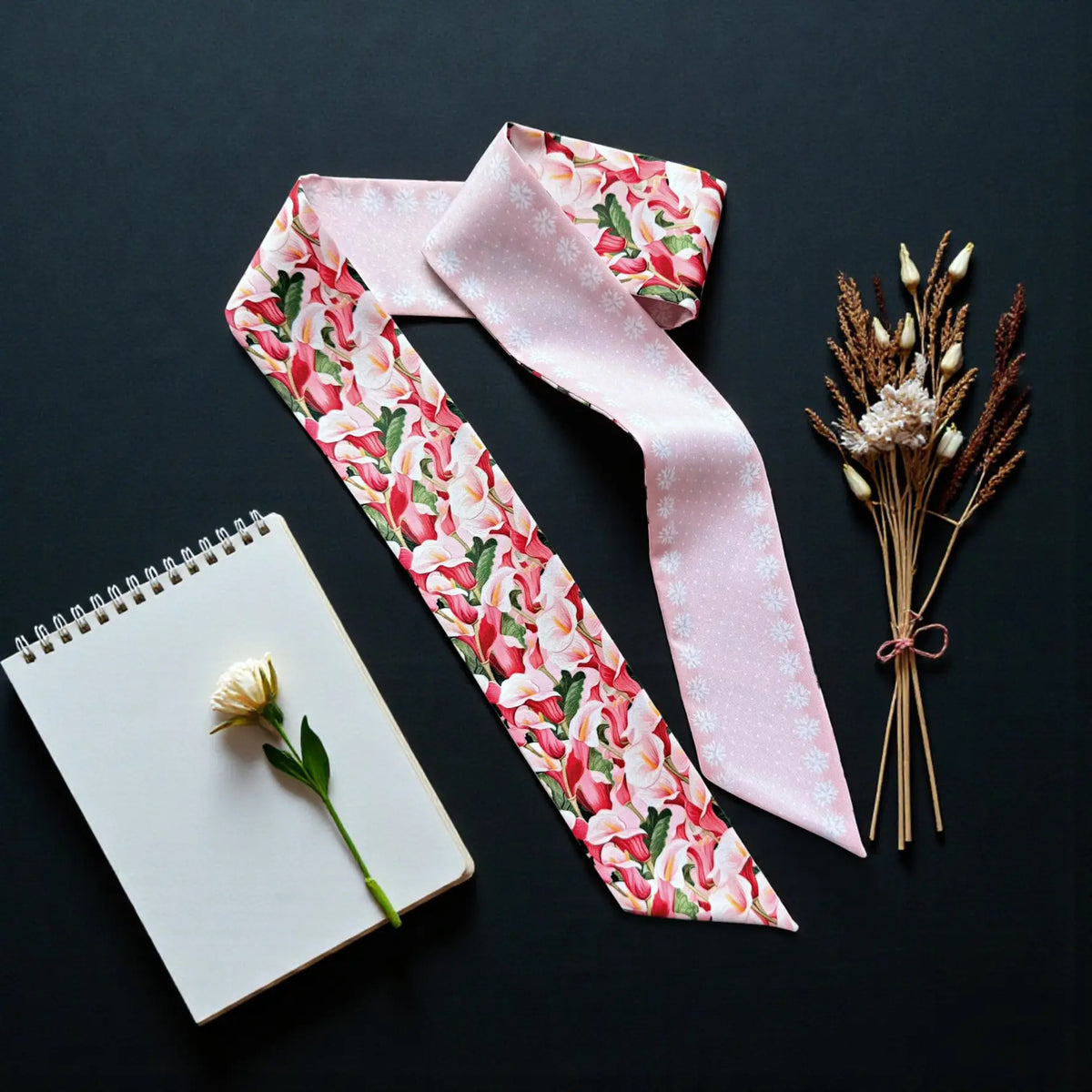 Calla lily floral twilly scarf featuring vibrant pink, red and ivory flowers with a soft pink reverse design.
