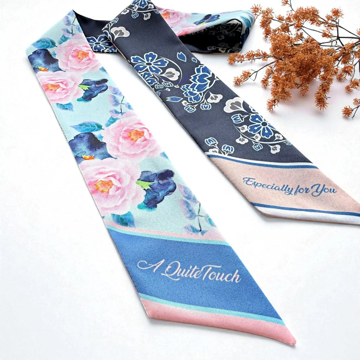 Elegant botanical skinny scarf with pink blossoms, blue foliage and ornamental floral details