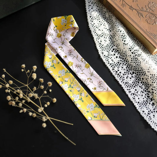 Yellow and blush pink botanical twilly scarf featuring delicate wildflowers and vintage floral details