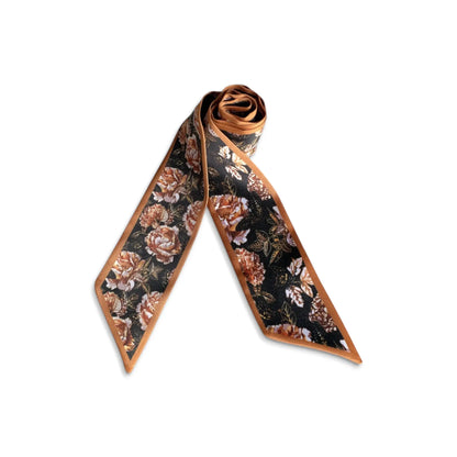 Rolled vintage floral twilly scarf featuring dark botanical roses in black, rust and warm brown tones