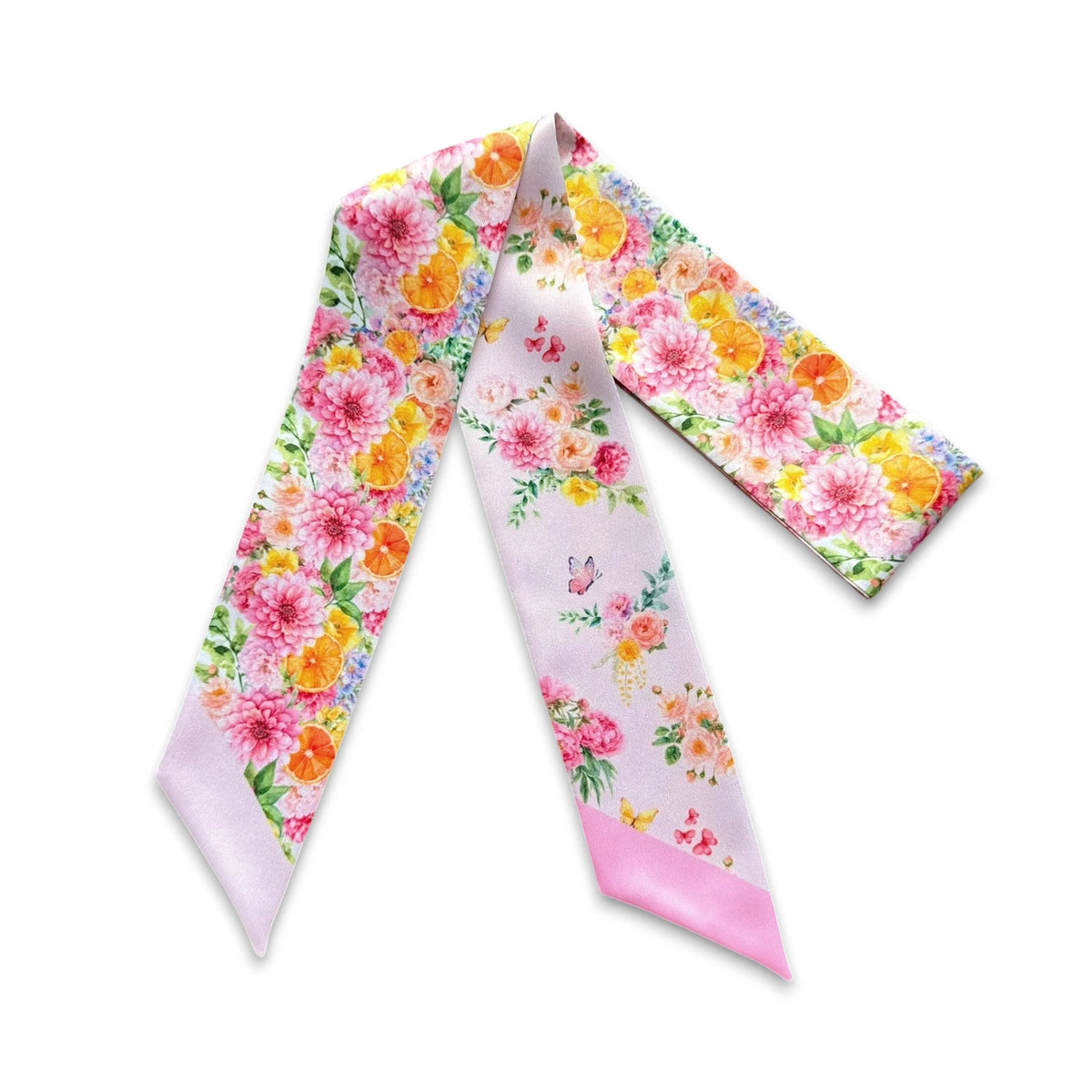 Full view of pink botanical twilly scarf with vibrant garden flowers, citrus details and butterfly motifs