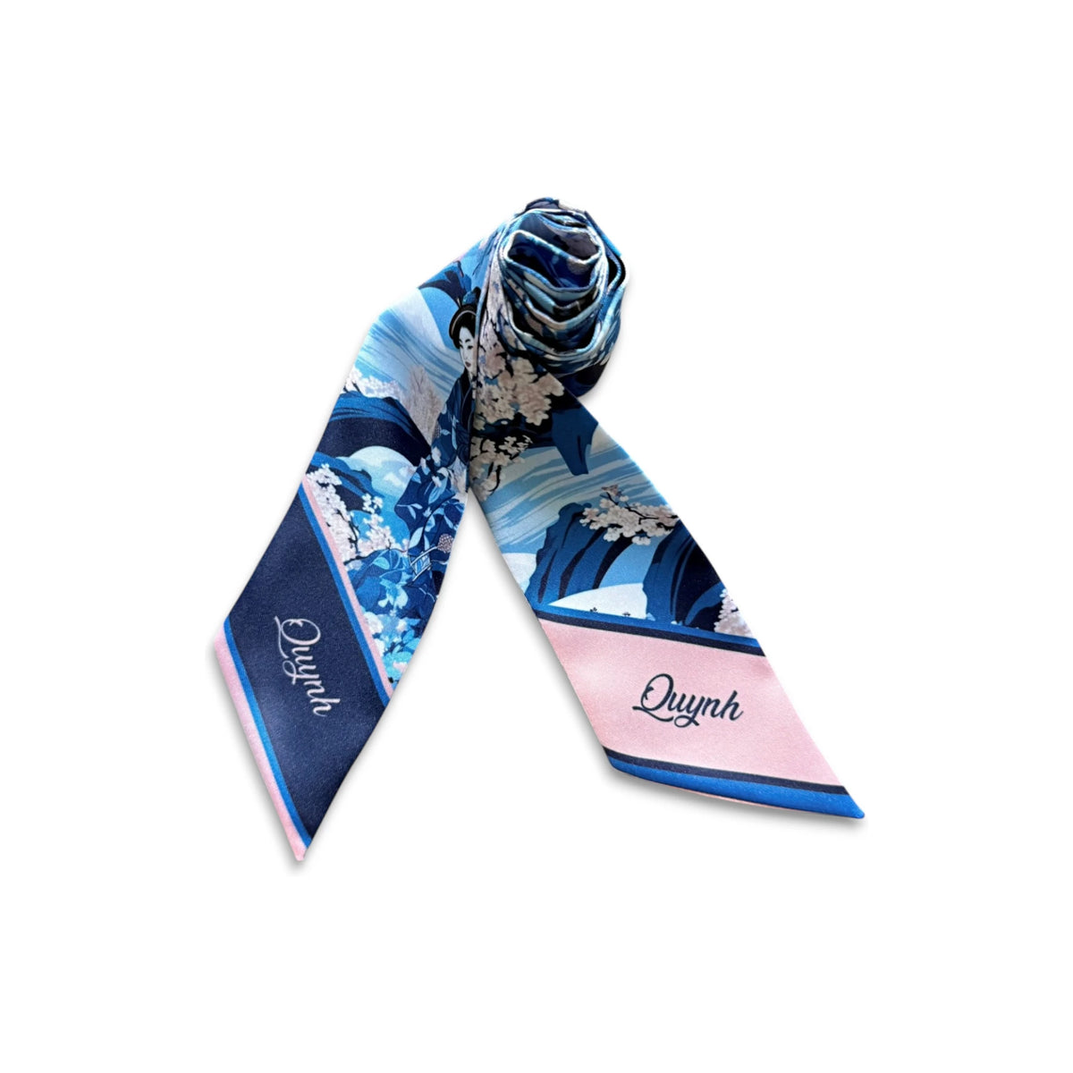 Blue botanical twilly scarf with Japanese cherry blossoms, soft pink details, and flowing wave patterns, suitable for styling as a hair scarf or handbag accessory.