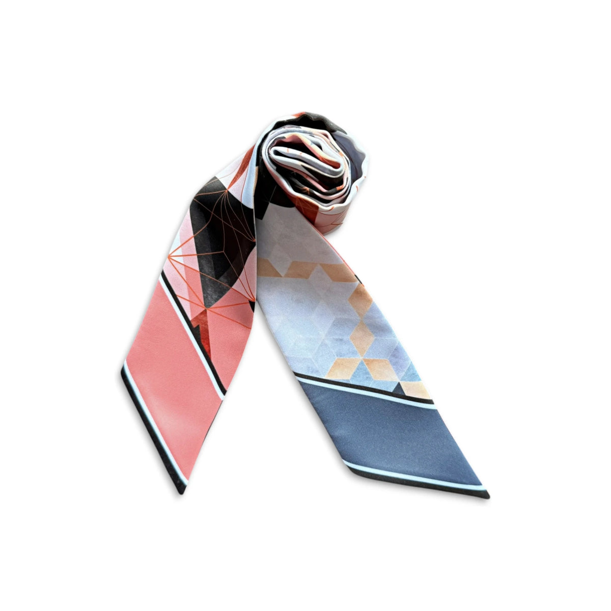 Two personalised satin twilly scarf ends displaying the name Julia in elegant black script, featuring coral pink and slate blue geometric designs against a dark background.