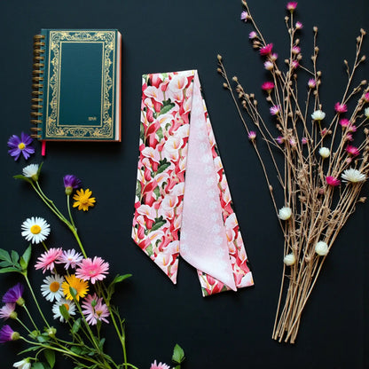 Elegant floral twilly featuring vivid calla lilies in pink, red, ivory and green with a delicate pink reverse.