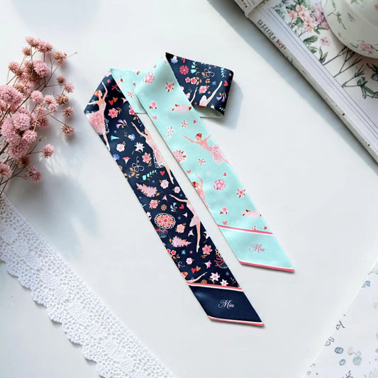 Personalised ballerina twilly scarf featuring graceful pink ballet dancers, colourful floral motifs, and contrasting navy blue and mint green backgrounds with custom name Mia.