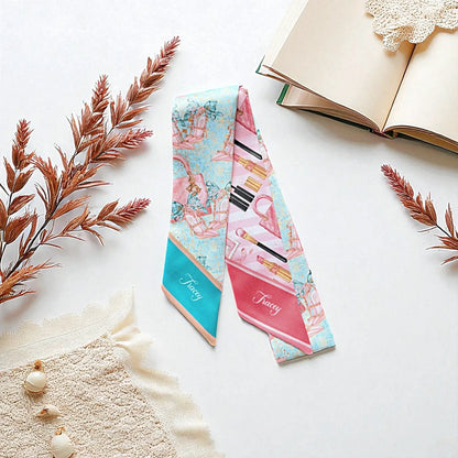 Turquoise satin bag scarf decorated with pastel pink handbags, fashion accessories, and delicate decorative details, featuring a custom name on the scarf tip.