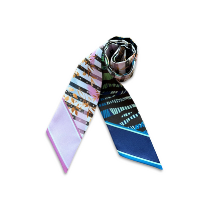 Elegant twilly scarf with abstract botanical leaves and geometric stripes in contrasting colours