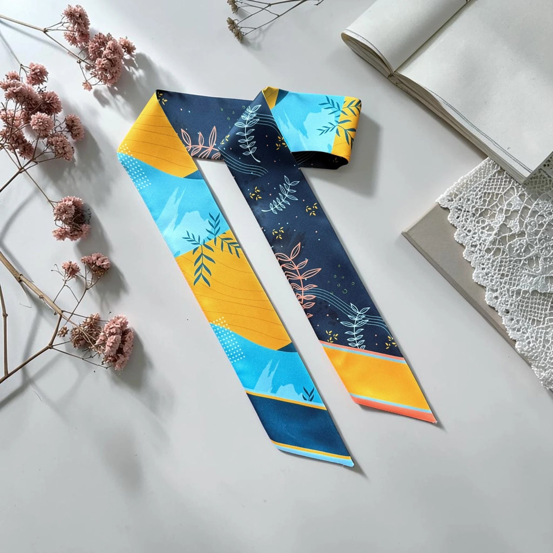 Double-sided twilly scarf with abstract botanical leaf pattern in blue and yellow modern design