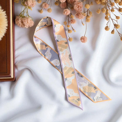 Silk twilly scarf with abstract botanical pattern in soft beige and gray tones
