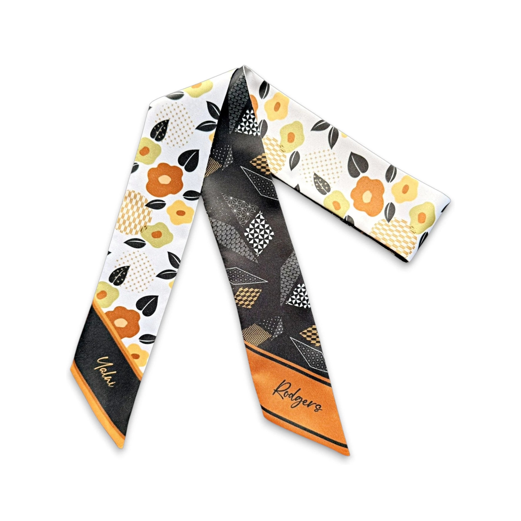 Elegant personalized skinny scarf gift with floral motifs and geometric patterns in brown, black and orange palette