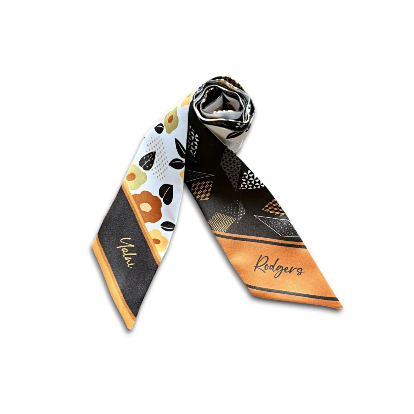 Thoughtful personalized gift twilly scarf with custom name detail and modern floral geometric design in warm tones