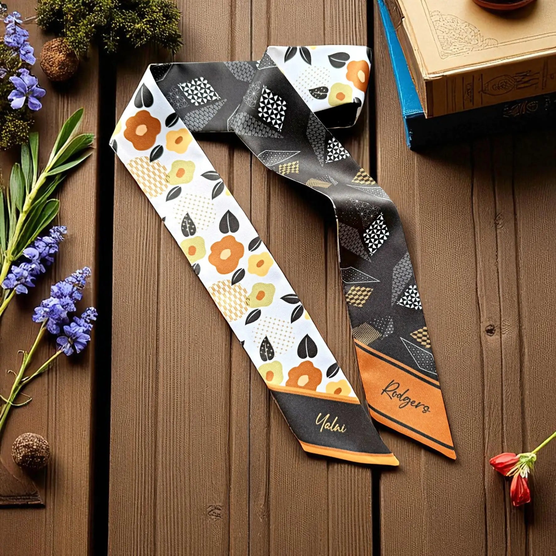 Double-sided twilly scarf with floral and geometric pattern in brown, black and orange tones 
