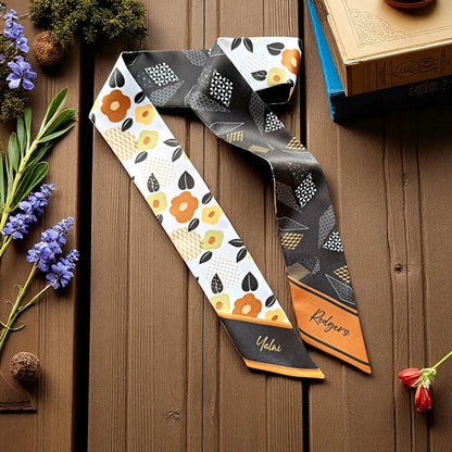 Double-sided twilly scarf with floral and geometric pattern in brown, black and orange tones 