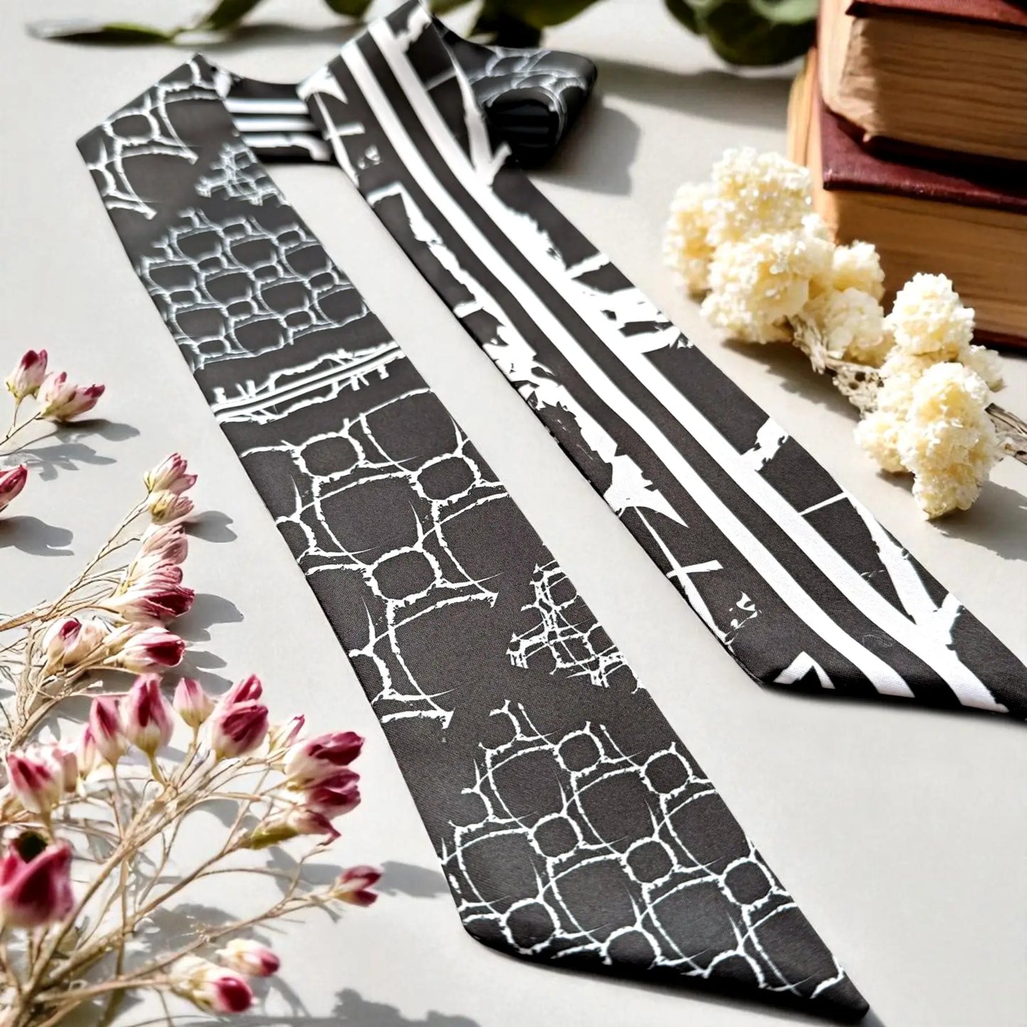 Black and white skinny twilly scarf with abstract geometric shapes and bold stripe design