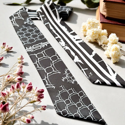 Black and white skinny twilly scarf with abstract geometric shapes and bold stripe design