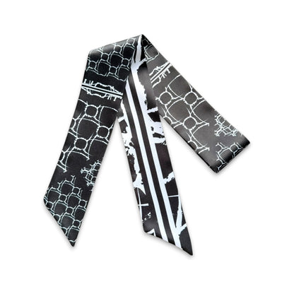 Stylish skinny scarf with contemporary geometric print in classic black and white tones