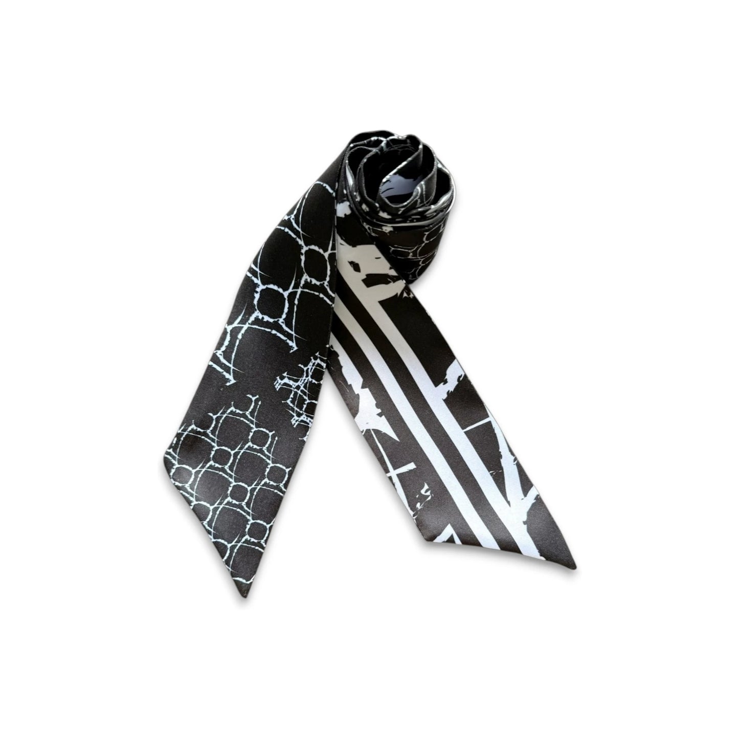 Monochrome twilly with black and white geometric and striped pattern in a modern design