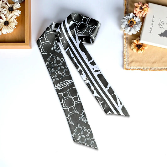 Monochrome twilly scarf with black and white geometric and striped pattern in a modern design