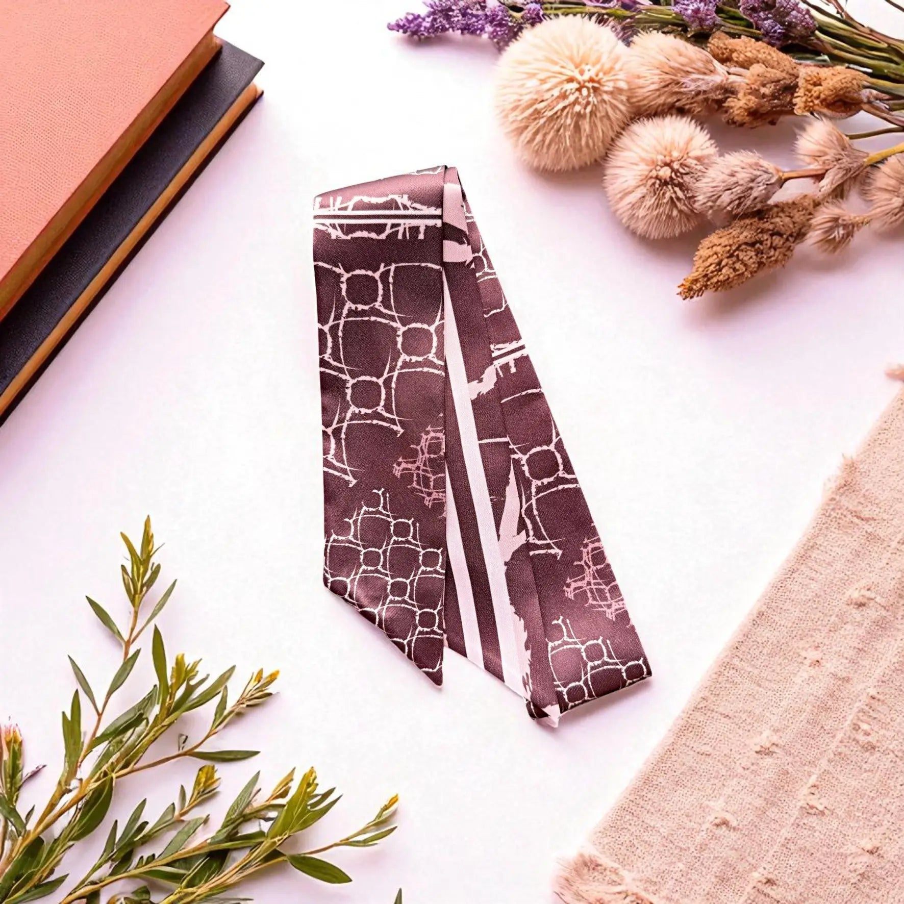 Elegant twilly scarf with muted maroon color palette and contemporary geometric print