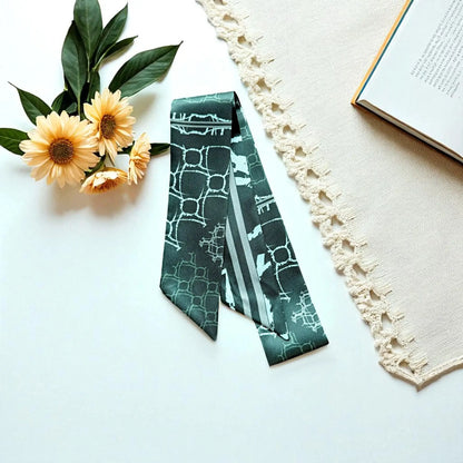 Modern twilly scarf with dark green tones and clean geometric print in a minimalist style