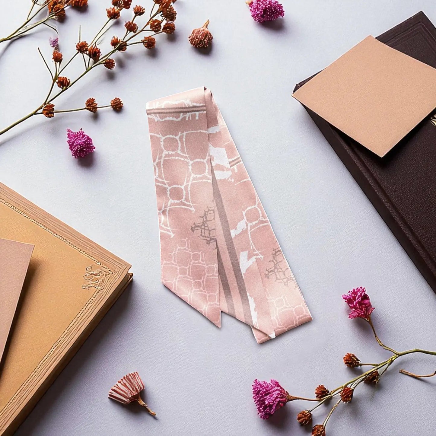 Modern twilly scarf with soft nude colour palette and delicate geometric print in a clean aesthetic