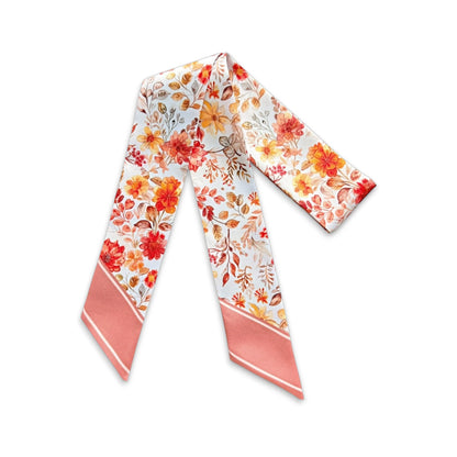 Elegant floral handbag scarf with soft botanical pattern in warm neutral tones