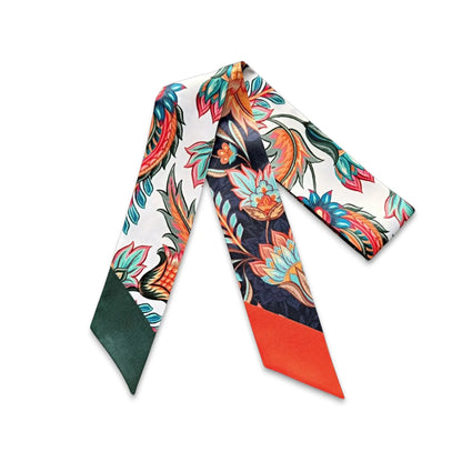 Annika twilly scarf with vibrant tropical floral pattern in multicolor tones, elegant skinny scarf for handbag styling