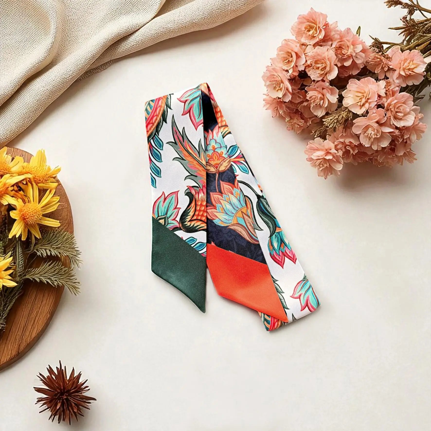 Skinny twilly scarf featuring colourful botanical design with vibrant floral elements
