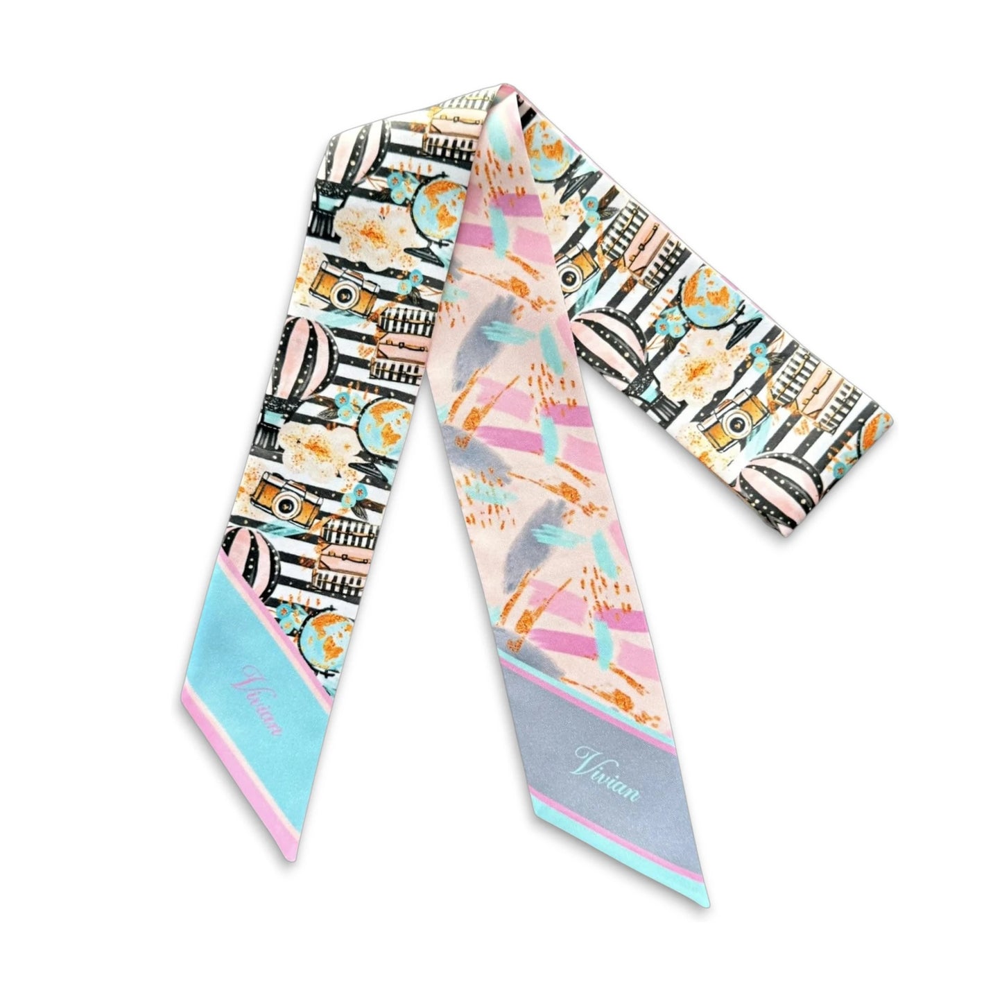 Handmade personalized twilly scarf with artistic travel-themed print in blush pink, aqua blue, and warm golden tones.