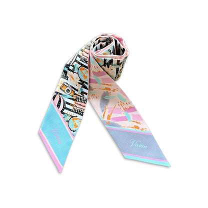 Luxury skinny scarf featuring a charming illustrated travel pattern with abstract pastel detailing.