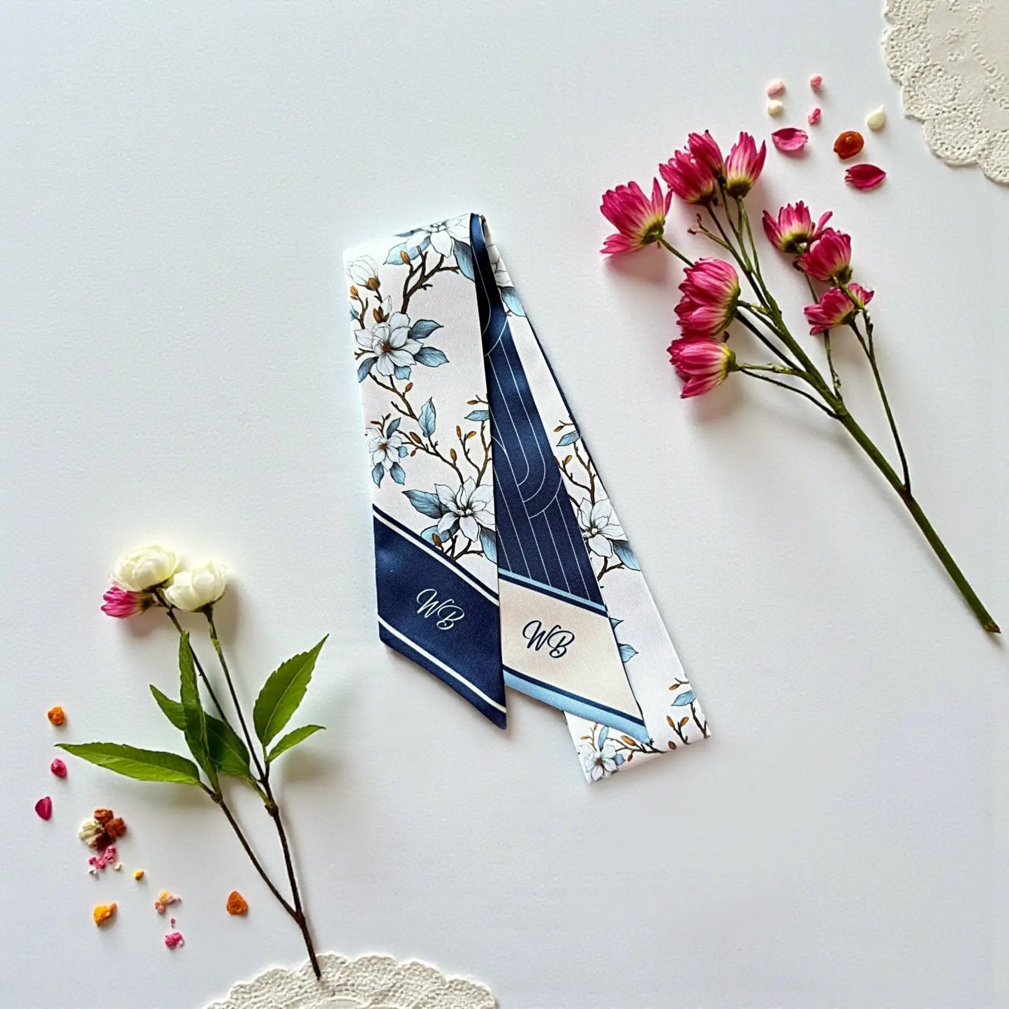 Custom floral skinny handbag scarf with blue magnolia pattern and monogram, perfect for purse handles and luxury accessories.