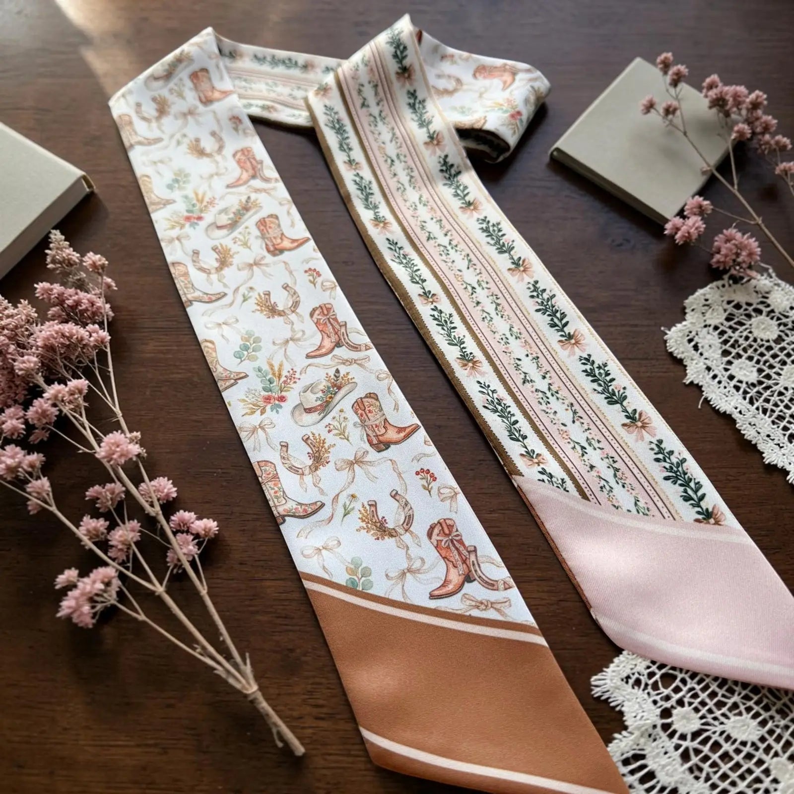 Elegant cowgirl twilly scarf with ornamental floral details and blush pink accents