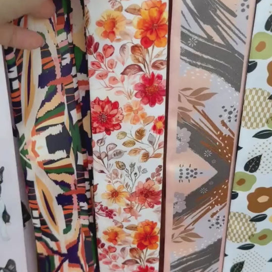 Video showing Amber twilly scarf with delicate floral pattern in orange and cream tones
