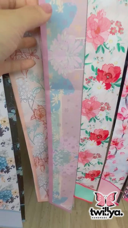 Video showing Amethyst twilly scarf with pastel floral and subtle geometric pattern