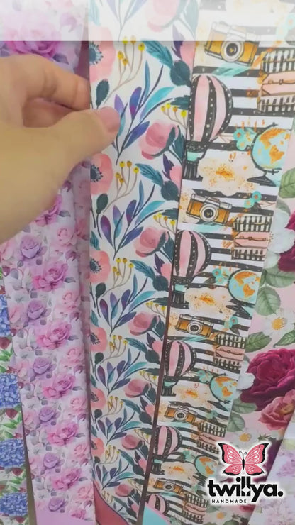 Close-up video of a personalized satin skinny scarf featuring elegant ornamental floral patterns and soft blush pink detailing, highlighting its luxurious texture and double-sided design.