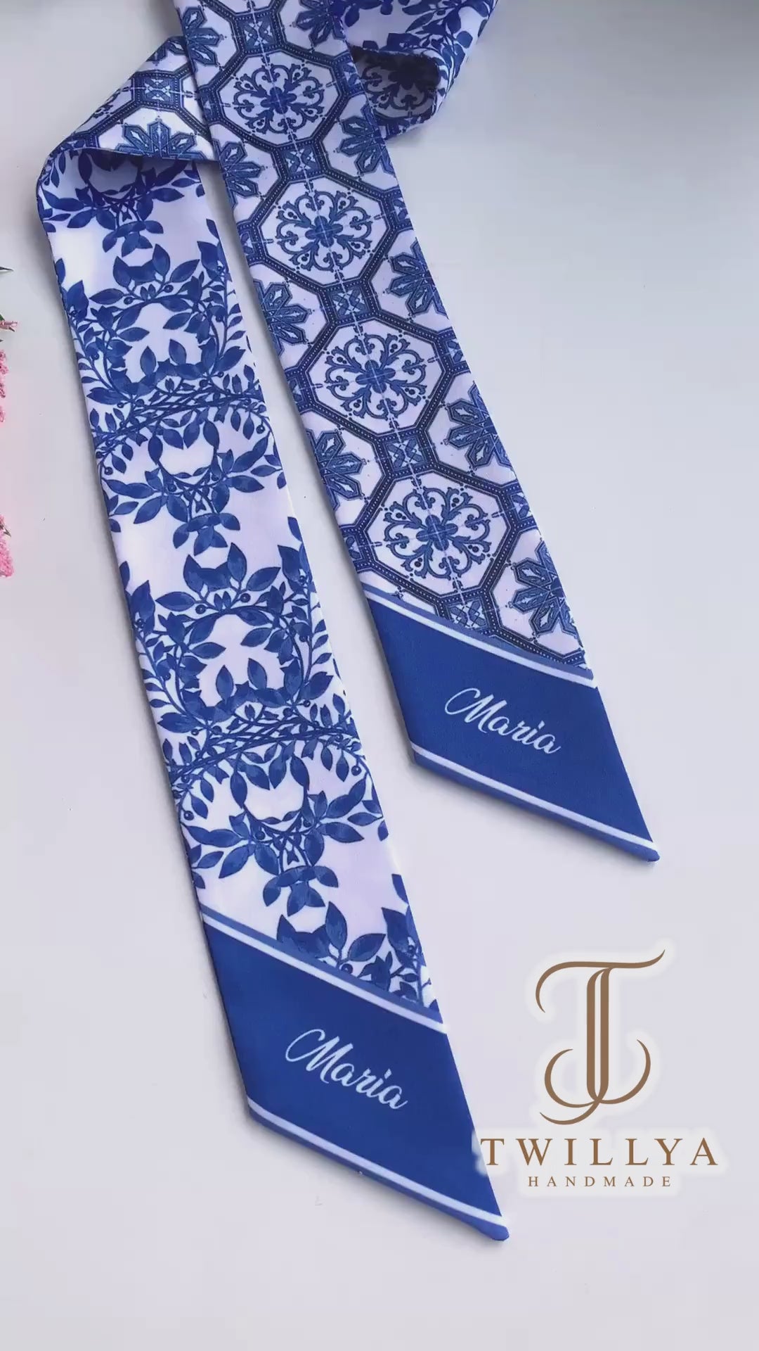 Video showcasing a blue and white Chinoiserie twilly scarf featuring porcelain-inspired tile patterns and elegant botanical foliage.