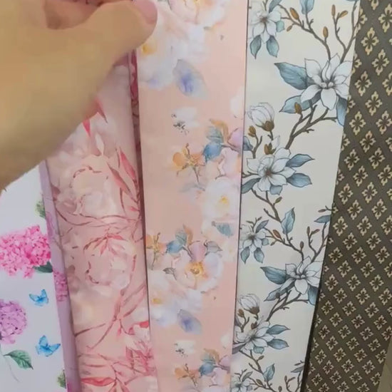Video showing elegant twilly scarf with pastel floral design in blush pink and blue colours
