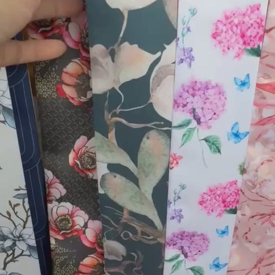 Personalized deep teal skinny scarf featuring elegant watercolor-style ivory flowers, sage green foliage, delicate branches, and custom name detailing on pointed ends.